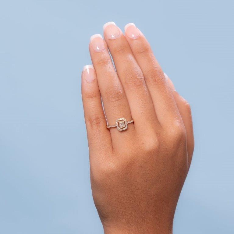 Round & Baguette Cut Diamond Halo Illusion Solitaire Engagement Ring (0.25 ct.) in 14K Gold